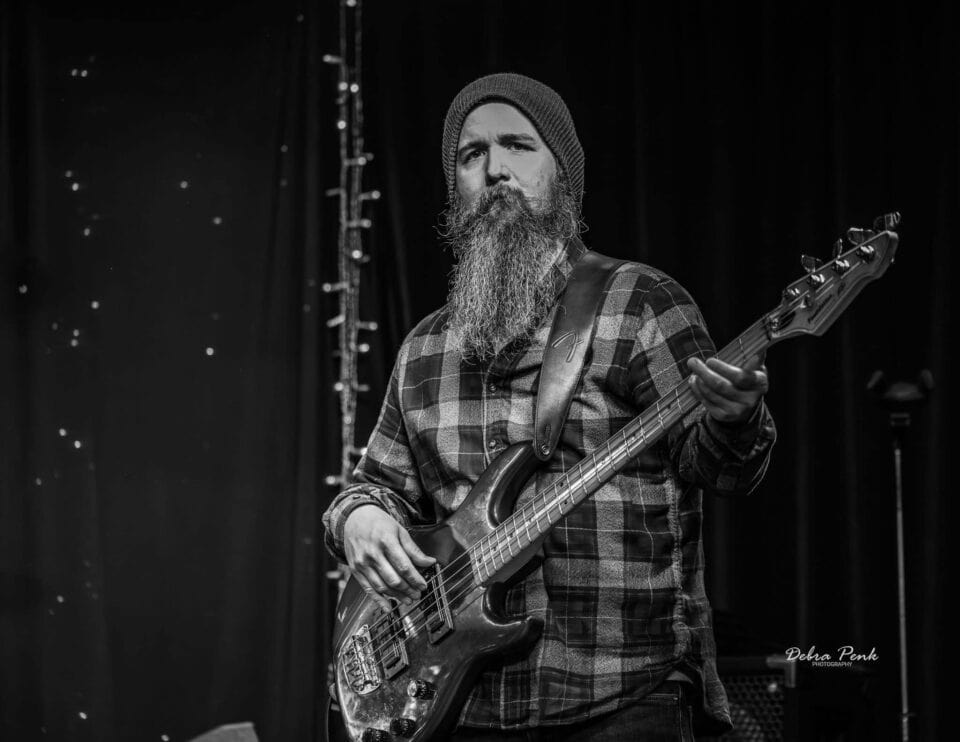Black and White picture of Bass Player Taylor Frazier.