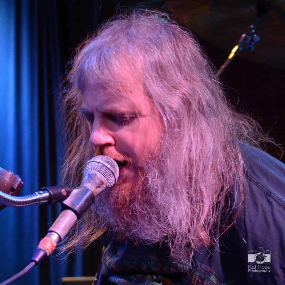 Johnny singing into a microphone.